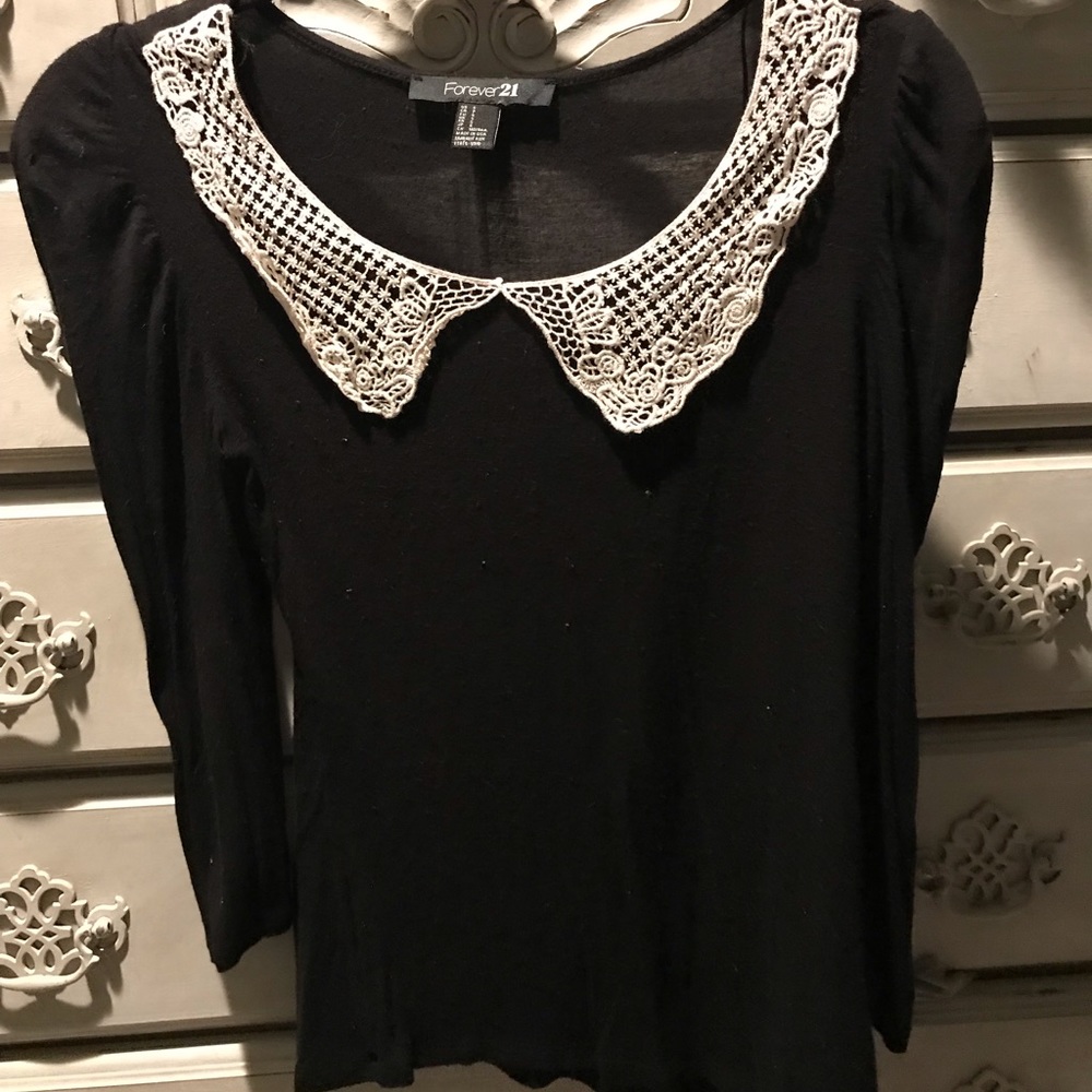 Black top with crochet lace bib